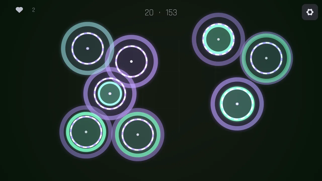 A crowded board of green and purple rings, wave twenty, score one hundred and fifty-three.